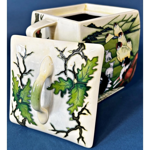 2039 - A Moorcroft Swales dale Biscuit jar and cover with loop handles, decorated to all sides of sheep in ... 