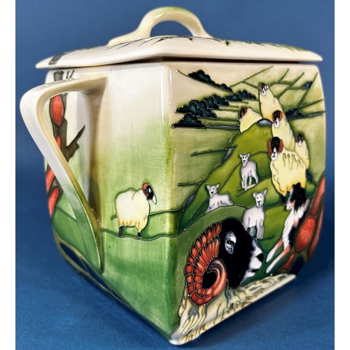 2039 - A Moorcroft Swales dale Biscuit jar and cover with loop handles, decorated to all sides of sheep in ... 