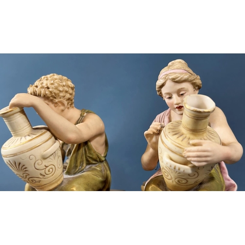 2046 - A pair of Royal Dux figures of male and female characters decorating ceramic pots