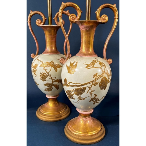 2049 - A pair of porcelain vases with drawn necks and scrolled handles adapted as table lamps