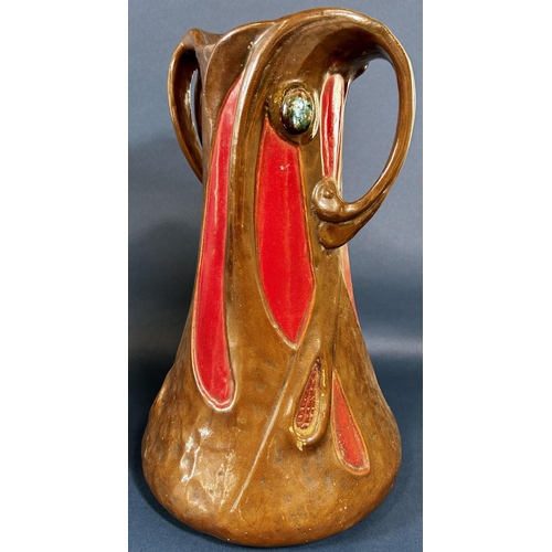 2051 - A Bretby ware vase in the art nouveau form with scrolled handles and a further studio pottery ewer w... 