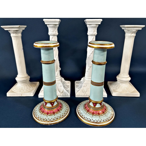 2059 - Three pairs of column candlesticks including a pair of Worcester white ground sticks and Susie Coope... 