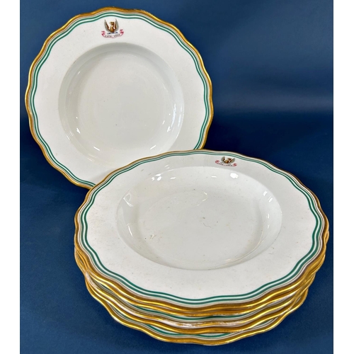 2061 - A collection of 19th century armorial tableware retailed by Phillips and Goode, principally soup bow... 