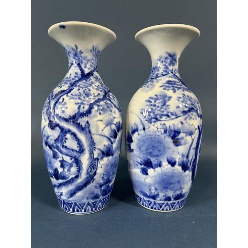 2080 - A pair of Japanese oviform vases with trumpet shaped necks and hand painted landscape detail