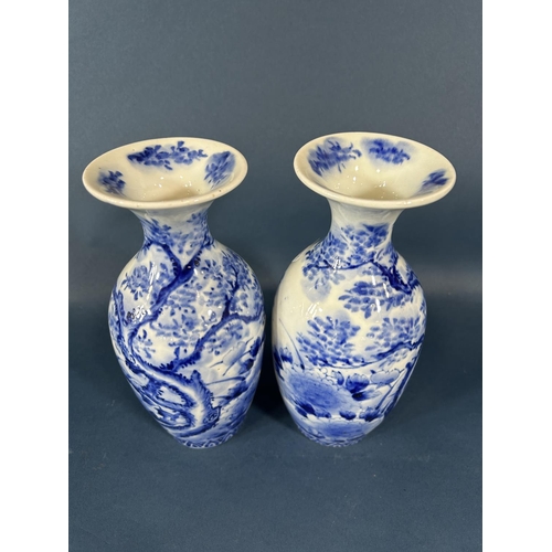 2080 - A pair of Japanese oviform vases with trumpet shaped necks and hand painted landscape detail