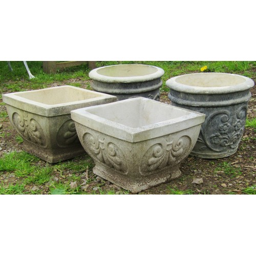 125 - A pair of weathered cast composition stone squat square tapered planters with repeating anthemion de... 