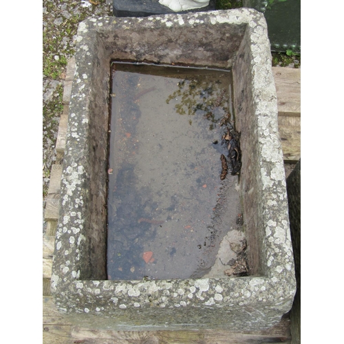 209 - A weathered natural stone trough 67 cm long x 43 cm wide x 32 cm high (slightly tapered)