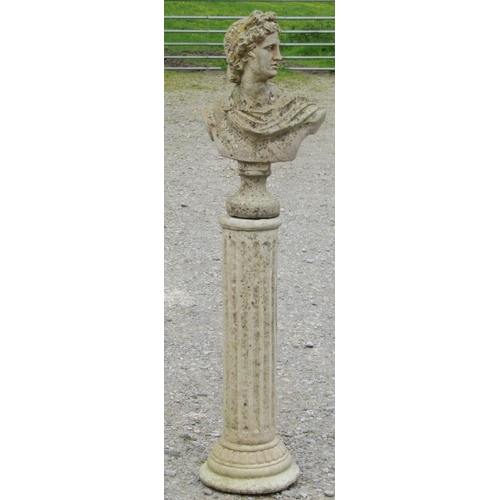 217 - A weathered cast composition stone bust of Apollo raised on a cylindrical fluted column pedestal 133... 