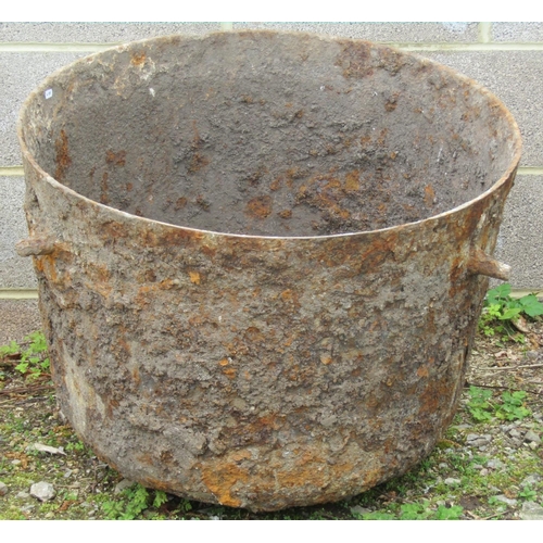 243 - A large antique cast iron cauldron 76cm diameter x 62cm high approximately (af) (appears to have bee... 