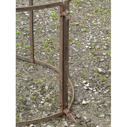 118 - A simple vintage heavy gauge two sectional steel strapwork rose arch/arbour with spear head finials