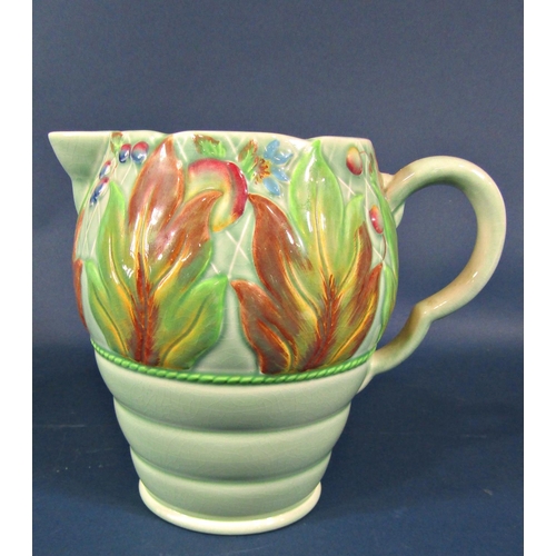 2089 - A Clarice Cliff jug with stylised embossed floral detail on a ribbed and tapered base