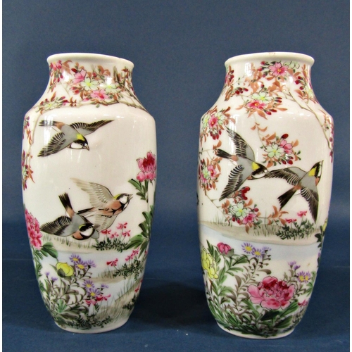 2100 - A collection of vases, comprising an oriental pair with peony and goldfinch decoration and marks to ... 