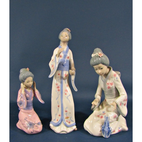 2104 - A collection of Lladro/Nao type figurines to include a girl feeding birds, three geisha girls, a whi... 