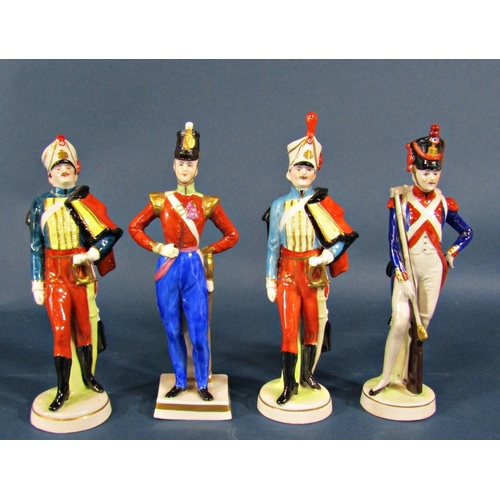 2106 - A collection of china figures comprising two masked Venetian carnival figures, an 18th century fusil... 