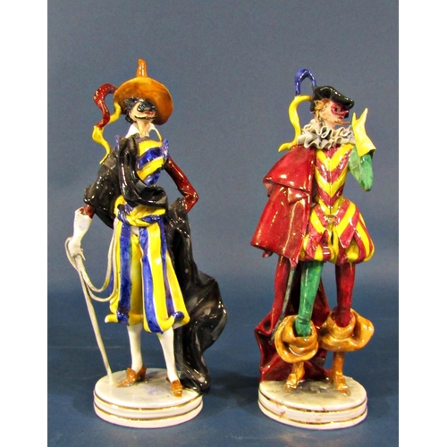 2106 - A collection of china figures comprising two masked Venetian carnival figures, an 18th century fusil... 