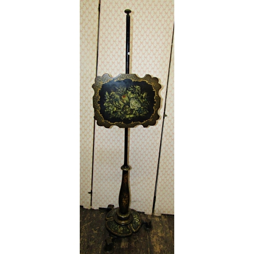 3555 - A Victorian lacquered pole screen with painted gilded and floral bouquet detail