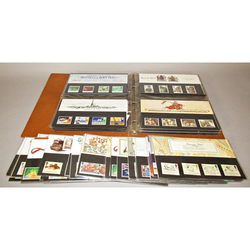 1259 - An album of mint presentation packs mainly from the 1990's together with a number of mint issue stam... 