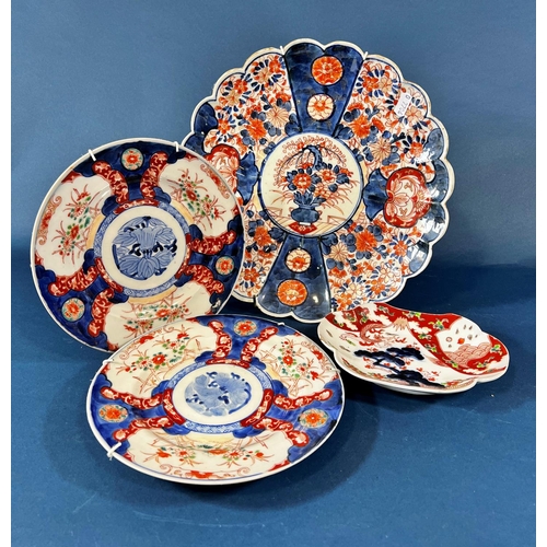 2080A - Four various Imari plates, blue and white, brick, and a Japaned vase.