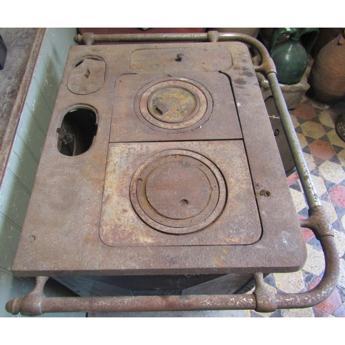 3009 - A French art deco cast iron and a blue enamelled stove with foliate detail (af for restoration) 83cm... 