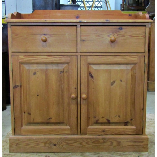 3106 - Stripped pine floorstanding side cupboard or small dresser enclosed by a pair of rectangular fielded... 