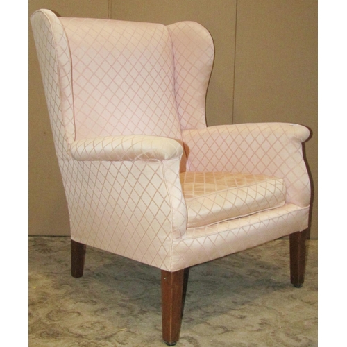 3081 - Georgian style wing armchair with light pink ground, repeating lattice patterned upholstery, loose s... 