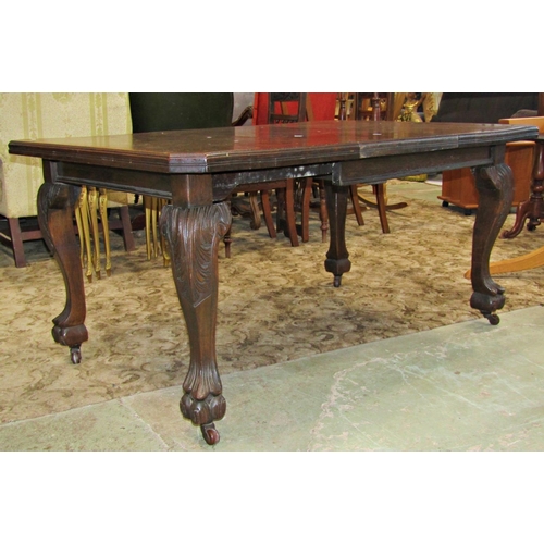 3101 - Edwardian oak wind out extending dining table, the rectangular top with moulded outline, canted corn... 