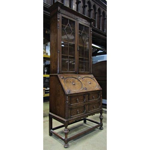 3128 - Good quality 1920s Jacobean revival oak bureau bookcase, with geometric, split moulded blind fret an... 