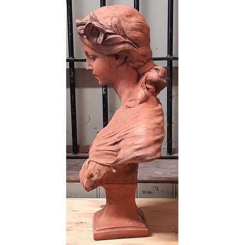 3005 - A terracotta bust of a young female in an arts and crafts style