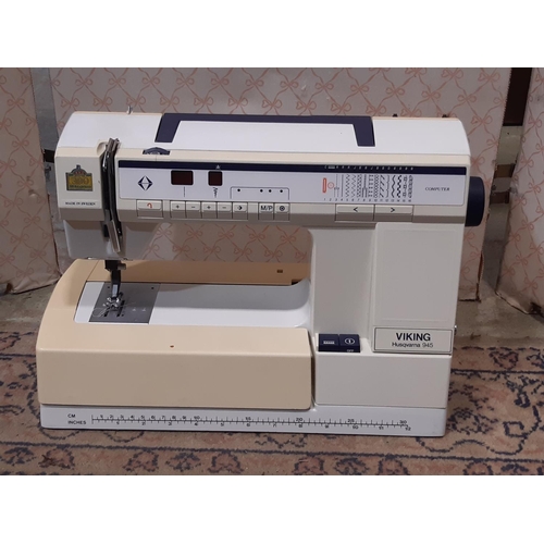 3066 - A Husqvarna 945 Viking sewing machine with travel case