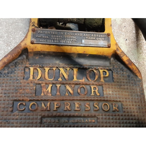 3072 - A vintage Dunlop Minor hand pumped compressor with original livery together with an ex ministry jerr... 