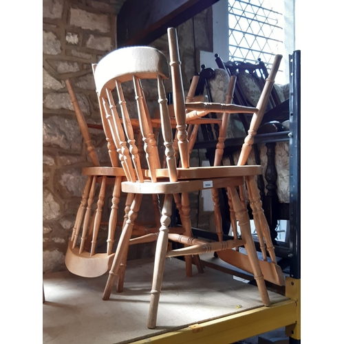 3084 - A set of four contemporary spindleback dining chairs on turned supports