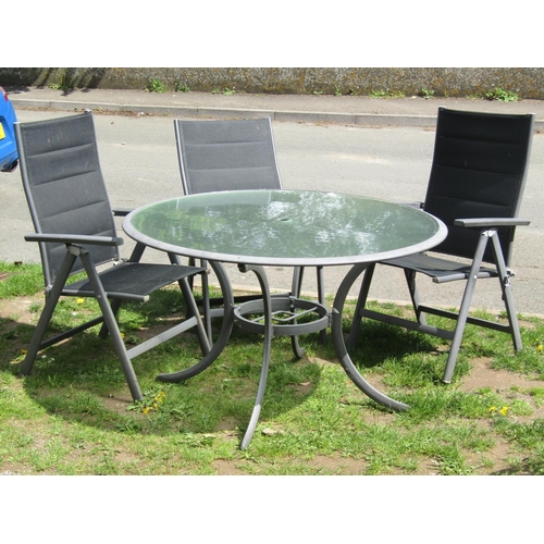 693 - A contemporary cast alloy four piece garden terrace set comprising circular inset glass top table 12... 