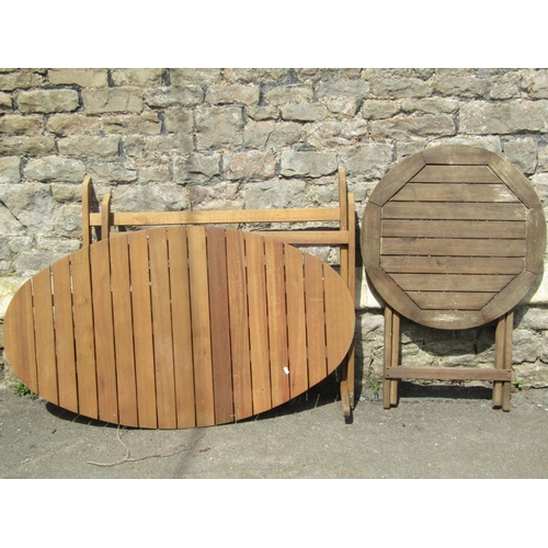 694 - A Royal Craft St Ives Elipsal teak oval folding bistro table (appears unused for assembly) together ... 