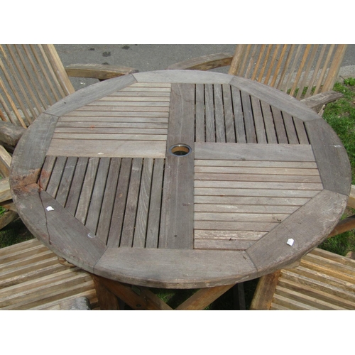 698 - A weathered hardwood five piece folding garden terrace set comprising circular top table 90 cm diame... 