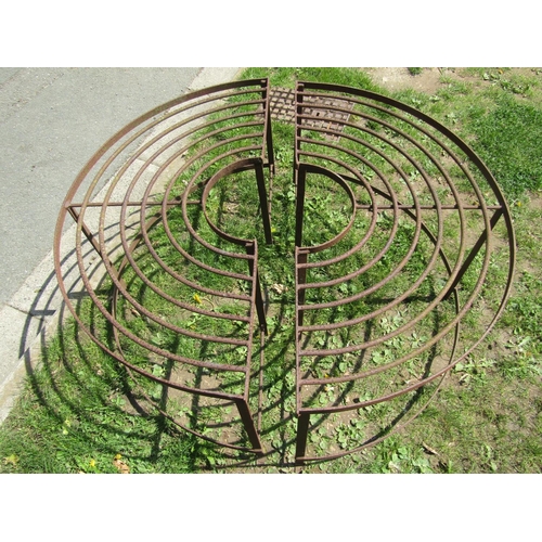 699 - An old two sectional weathered iron tree seat with radiating bar seat 113 cm diameter (full size) th... 