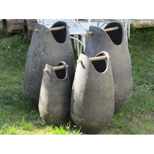 701 - Four Chinese matt glazed terracotta wide mouthed pails with simple cane handles, the largest example... 