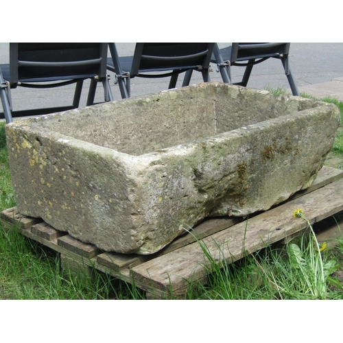 702 - A good weathered rectangular natural stone trough with tapered interior, 102 cm long x  63 cm wide x... 