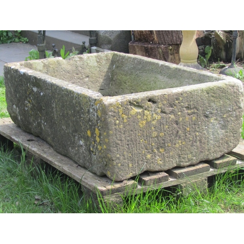 702 - A good weathered rectangular natural stone trough with tapered interior, 102 cm long x  63 cm wide x... 