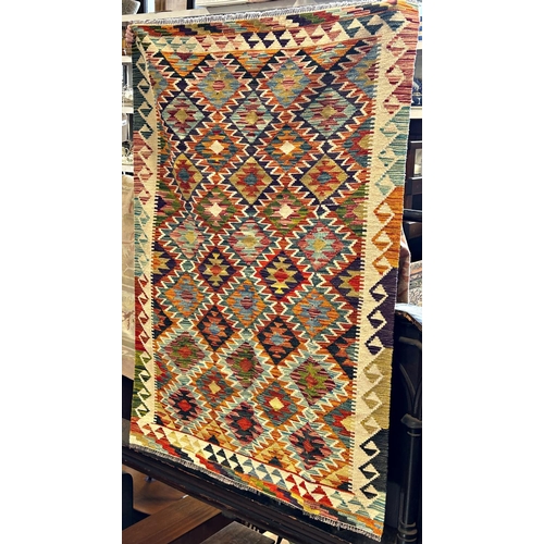 2685 - A Chobi Kilim with an all over multi coloured diamond pattern, 186cm x 128cm approx.