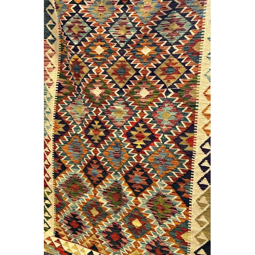 2685 - A Chobi Kilim with an all over multi coloured diamond pattern, 186cm x 128cm approx.