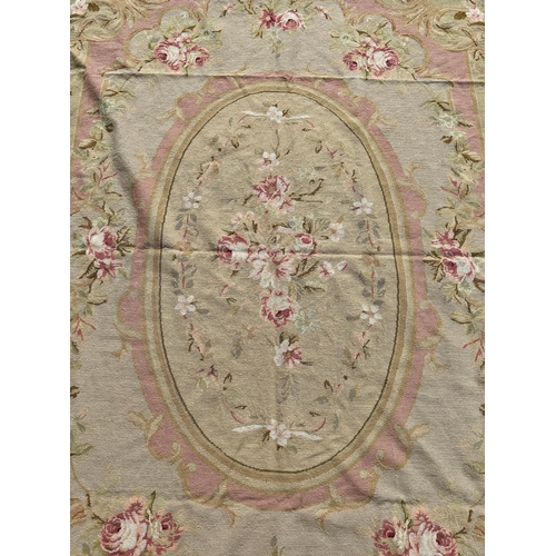 2691 - An Aubusson style tapestry wall hanging with a floral medallion and an all over pink rose pattern, 2... 