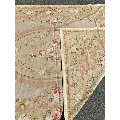 2691 - An Aubusson style tapestry wall hanging with a floral medallion and an all over pink rose pattern, 2... 