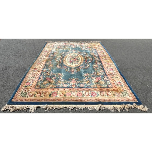 2694 - A large 18th century style thick pile wool carpet in the Neoclassical style of a floral pattern on a... 