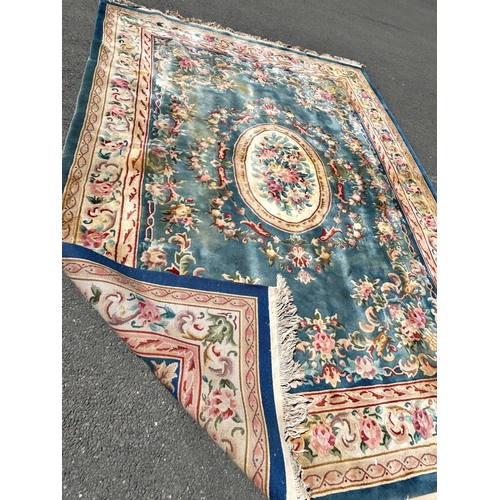 2694 - A large 18th century style thick pile wool carpet in the Neoclassical style of a floral pattern on a... 