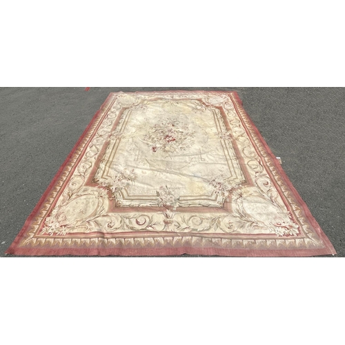 2699 - A large Aubusson style tapestry wall hanging with a central floral medallion and floral borders, tog... 