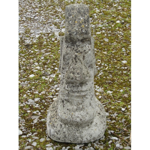 213A - A weathered cast composition stone Easter Island head garden ornament 50 cm high together with one o... 