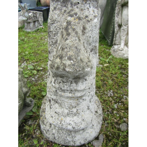 213A - A weathered cast composition stone Easter Island head garden ornament 50 cm high together with one o... 