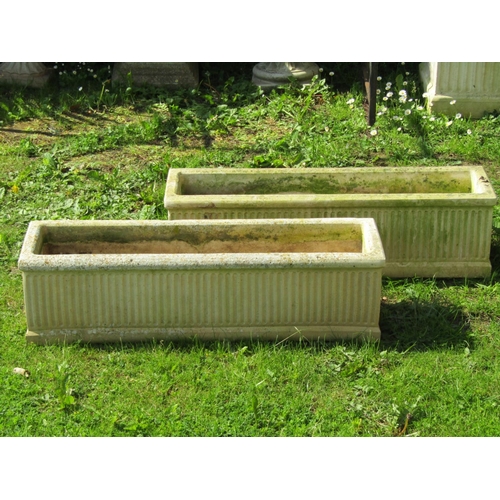 728 - A pair of weathered cast composition stone rectangular flower troughs with fluted detail, 92 cm long... 