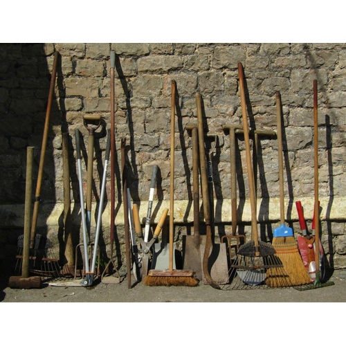 682 - A galvanised dustbin containing a collection of wooden long handled gardening tools, some with T sha... 