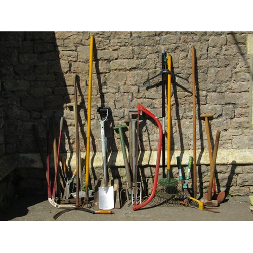 686 - A collection of long handled gardening tools, spades, forks, rakes, bow saw etc